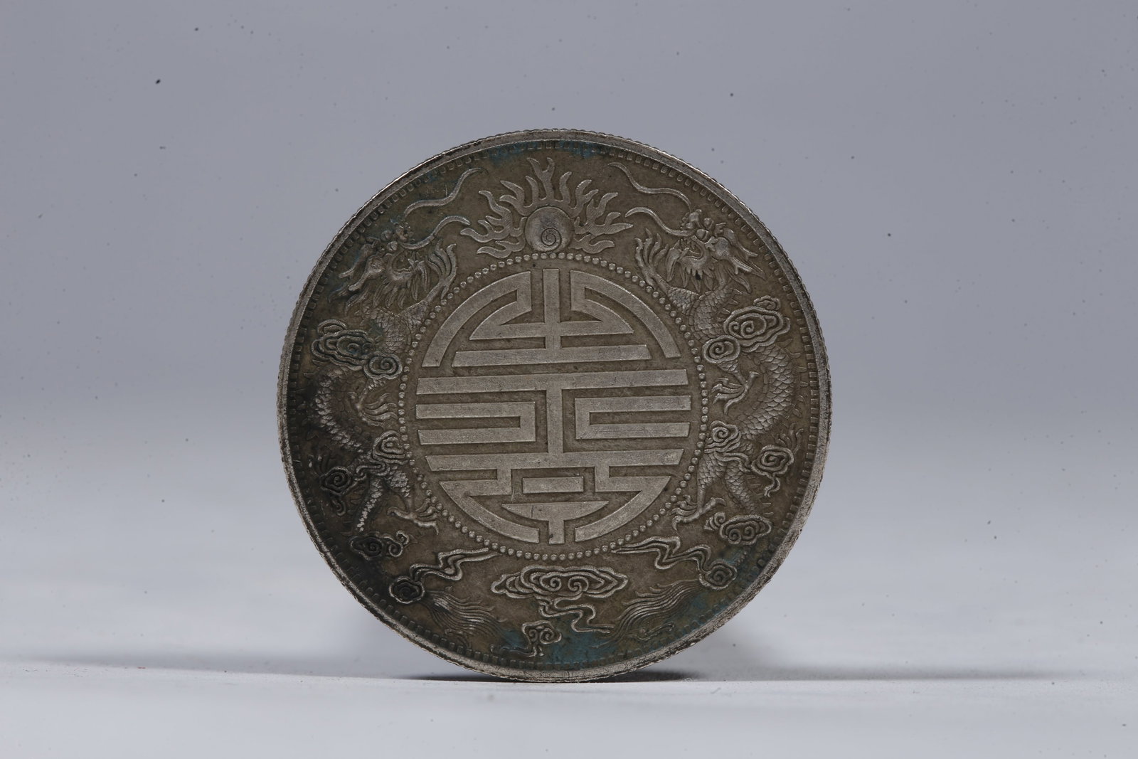 A SILVER DOLLAR COIN - 3
