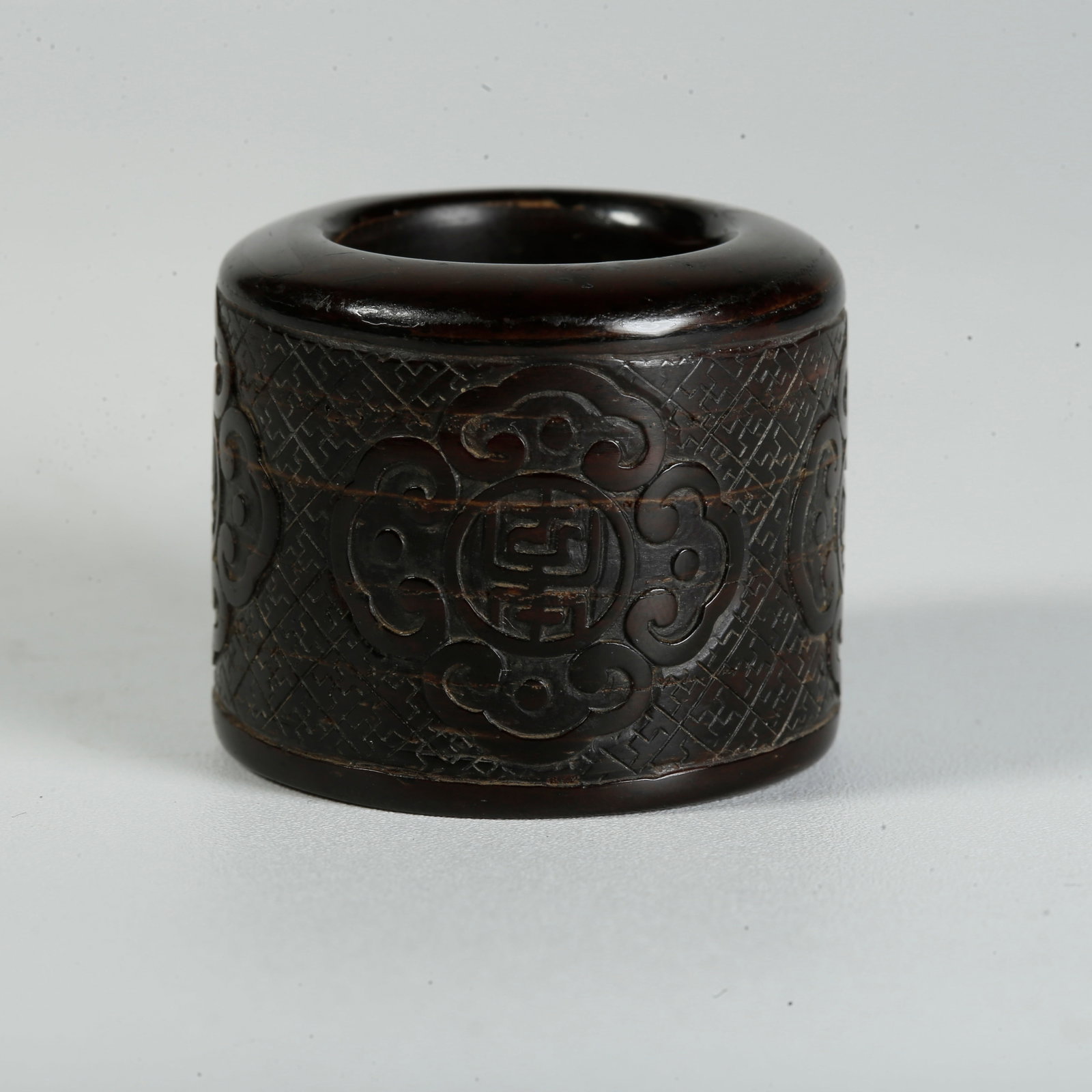 A COCONUT-SHELL THUMB RING WITH ROUND LONGEVITY CHARACTER PATTERN (1 of 9)