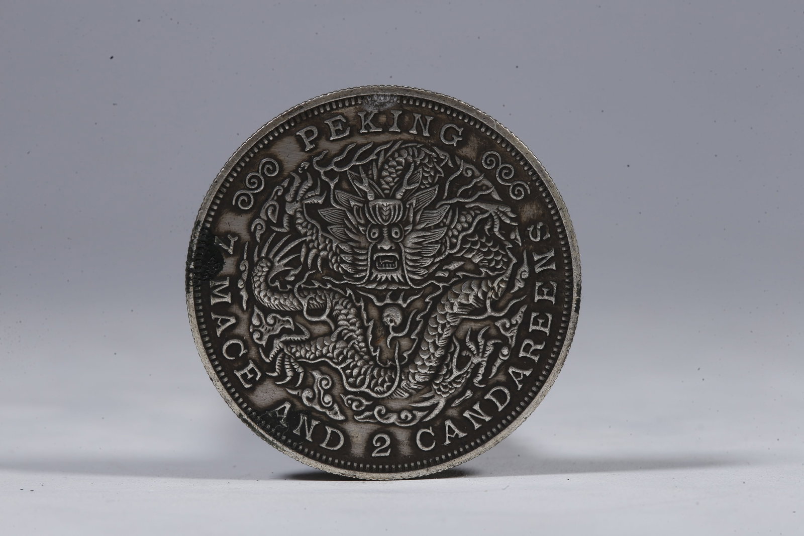 A SILVER DOLLAR COIN - 3