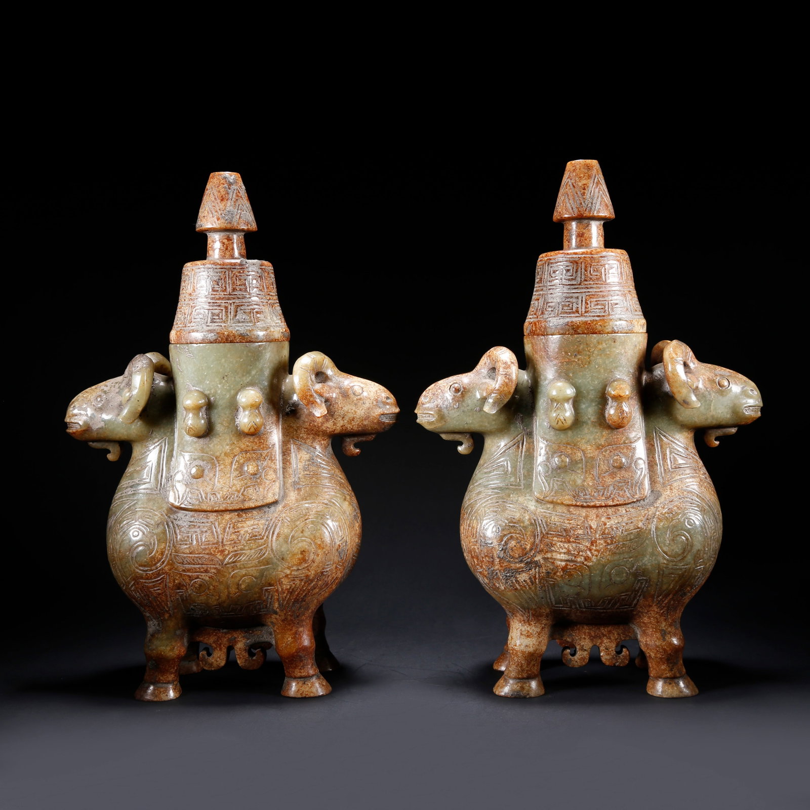 A PAIR OF ARCHAIC JADE LIDDED VASES WITH DOUBLE SHEEP EARS: Pair of Archaic Jade Lidded Vases with Double Sheep Ears
