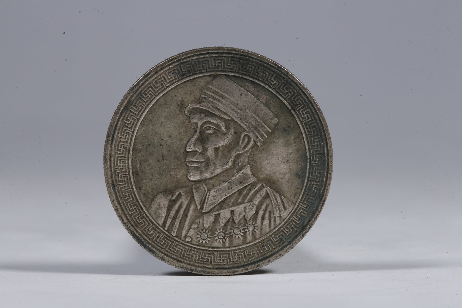 A SILVER DOLLAR COIN - 3