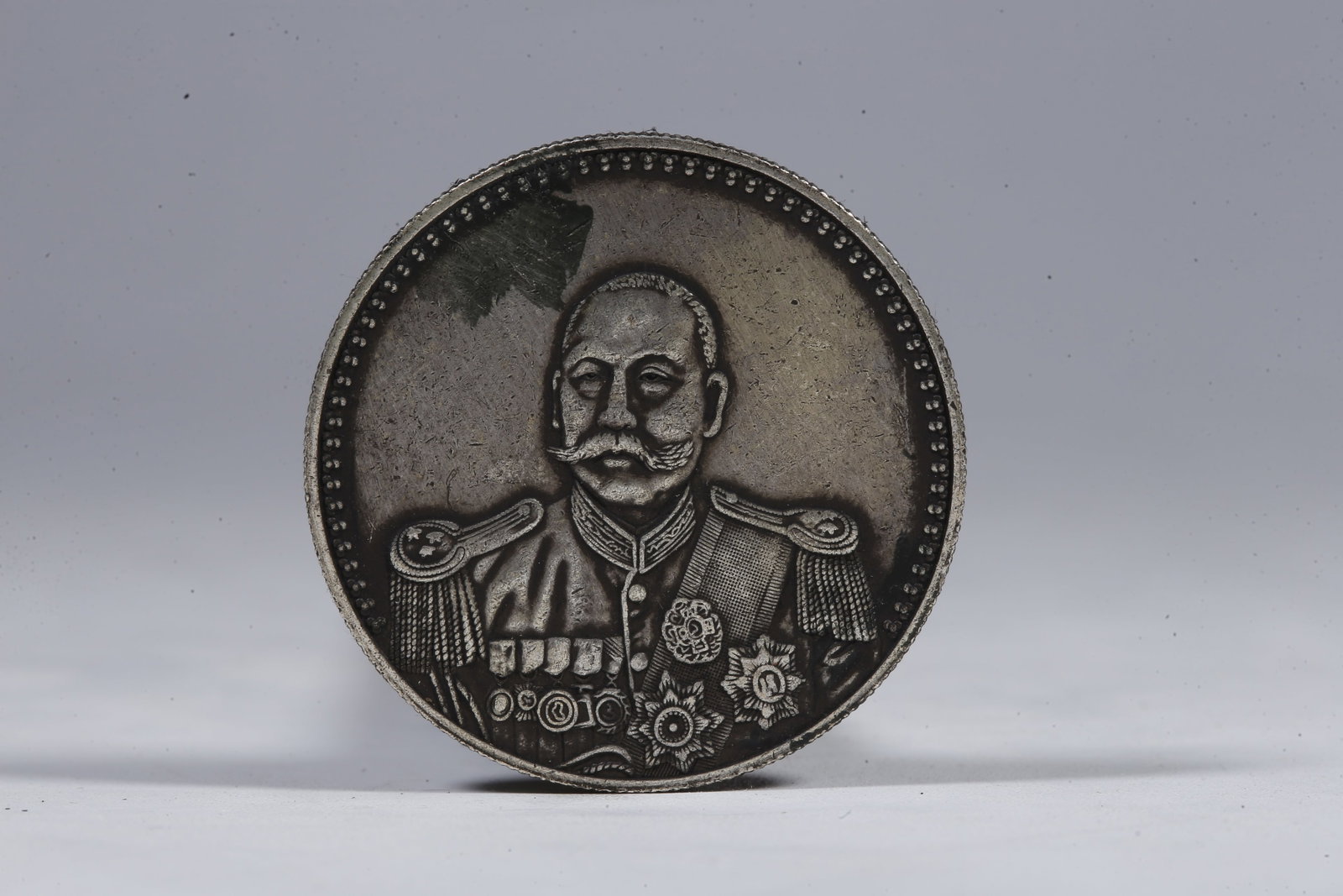 A SILVER DOLLAR COIN - 3
