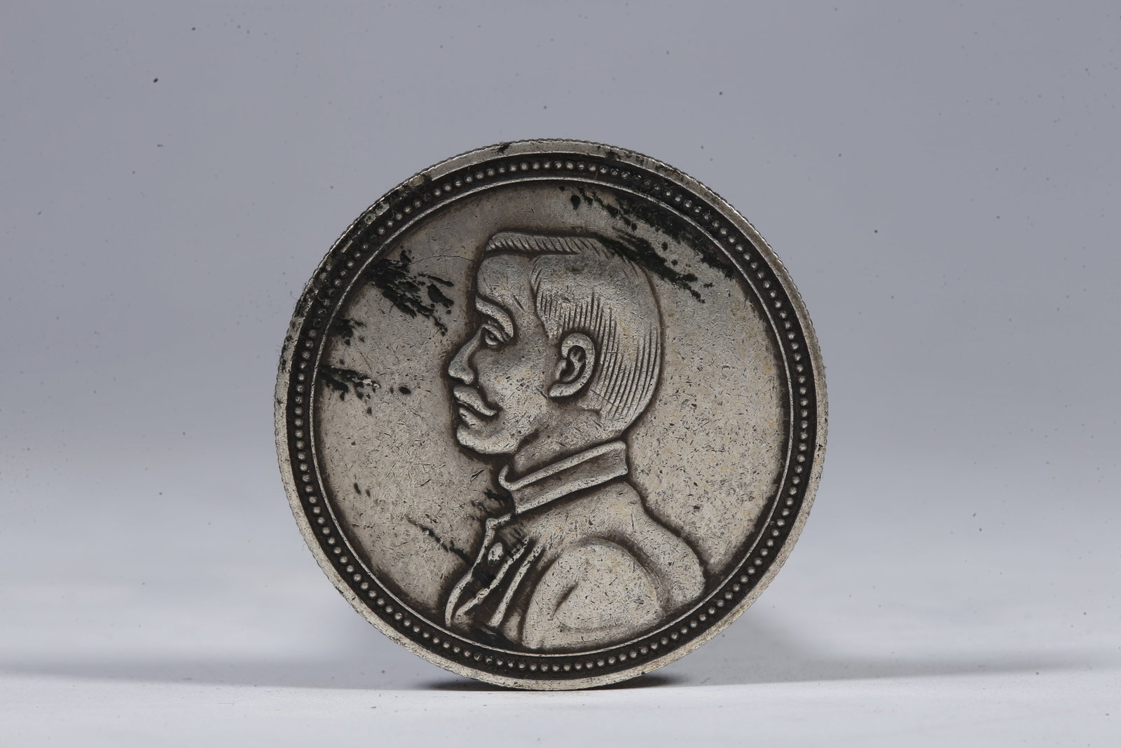 A SILVER DOLLAR COIN - 3