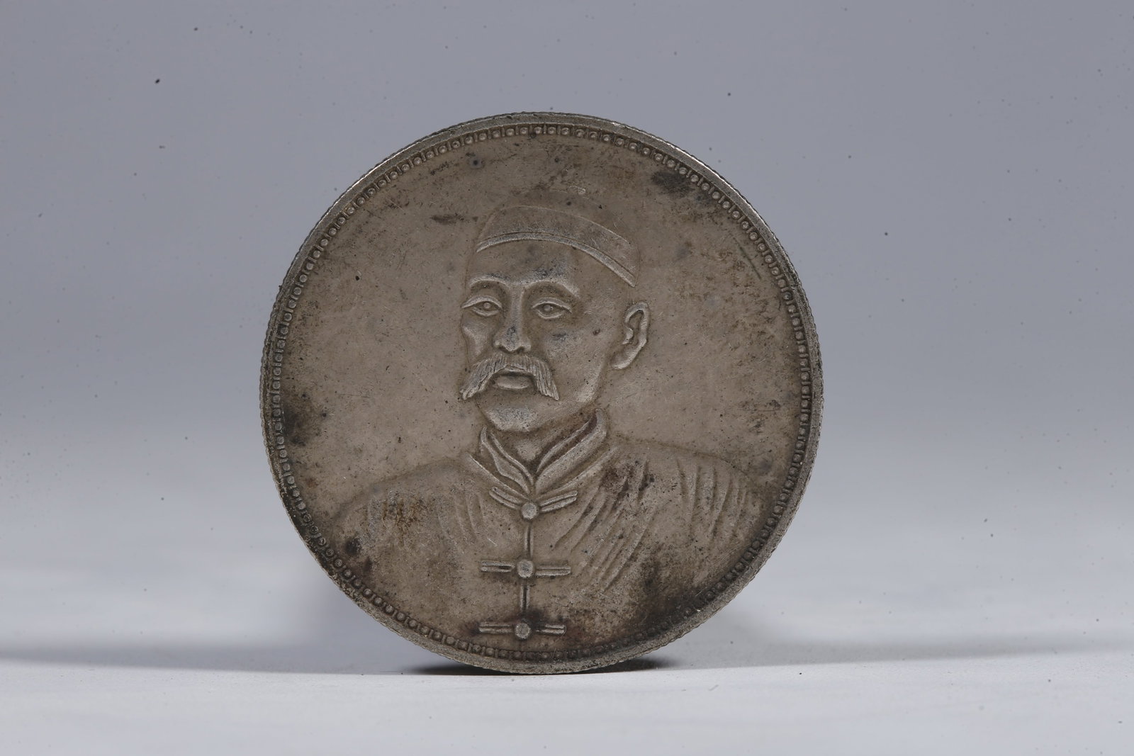 A SILVER DOLLAR COIN - 3