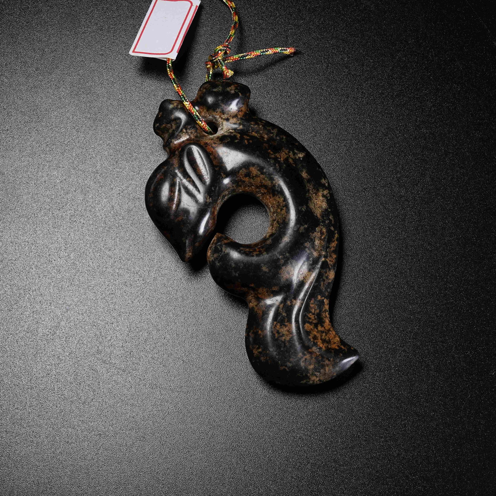 A ARCHAIC JADE DIVINE PHOENIX PENDANT (1 of 9)