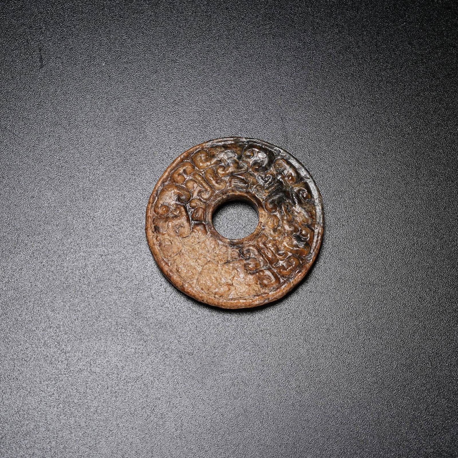 A ARCHAIC JADE BI DISC WITH HOOKED CLOUD PATTERN (1 of 8)