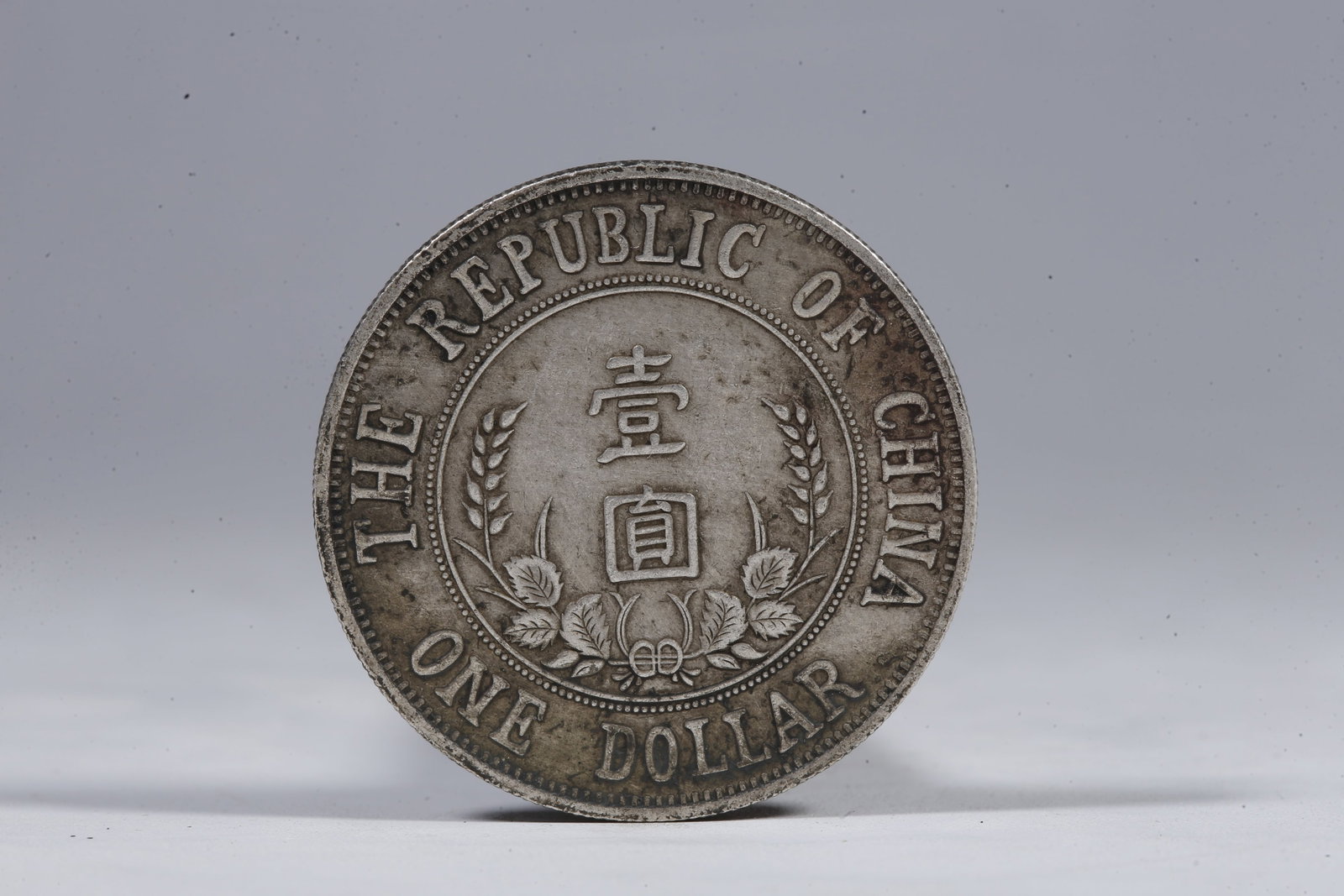A SILVER DOLLAR COIN - 3