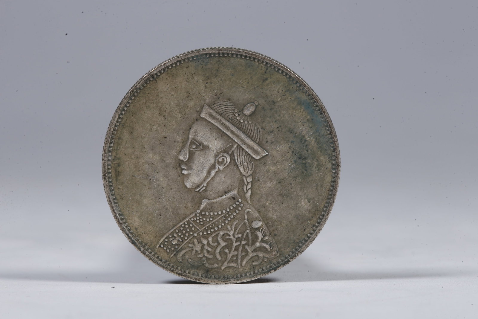 A SILVER DOLLAR COIN - 3