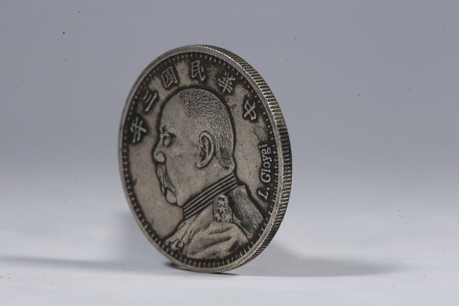 A SILVER DOLLAR COIN - 2