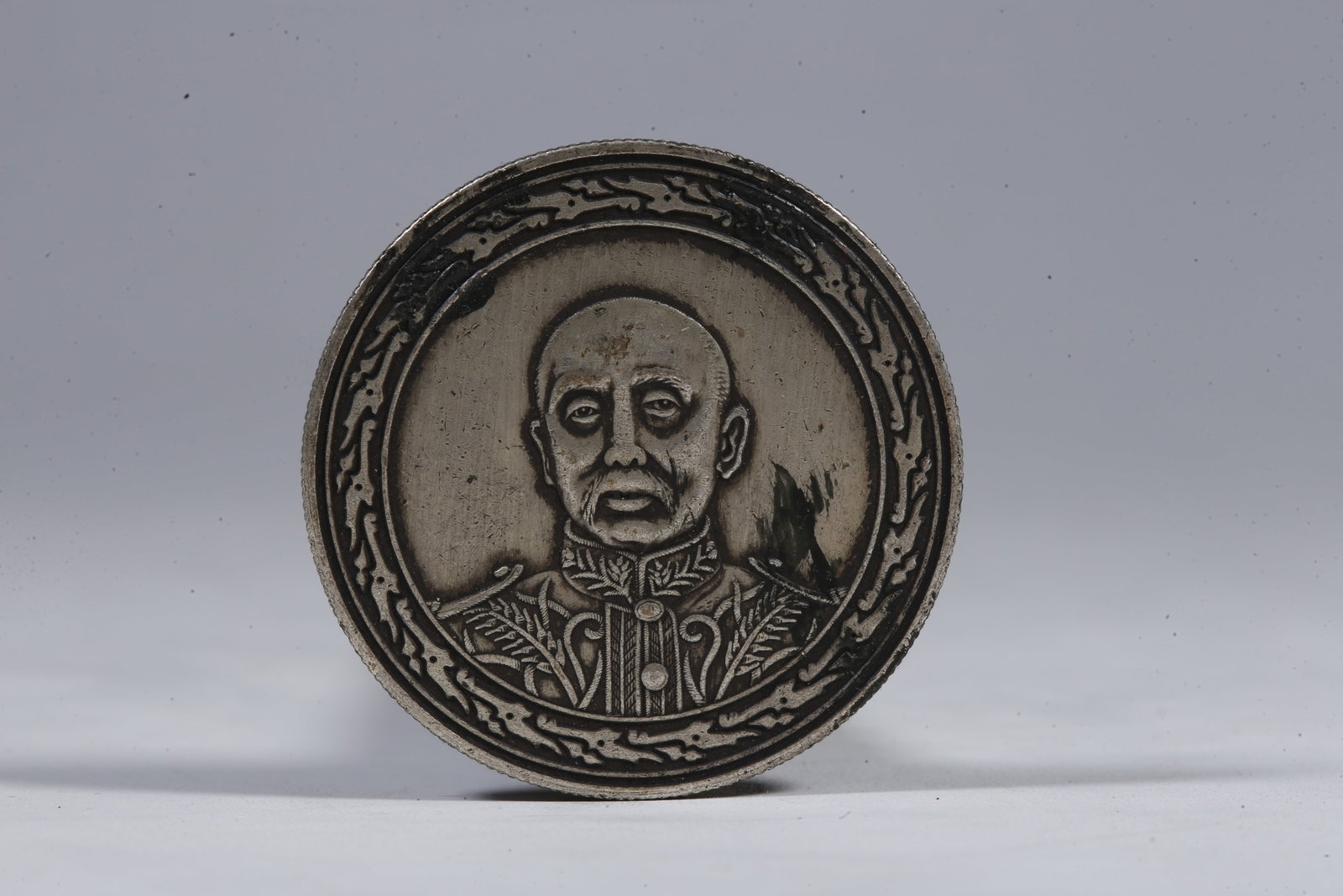 A SILVER DOLLAR COIN - 3