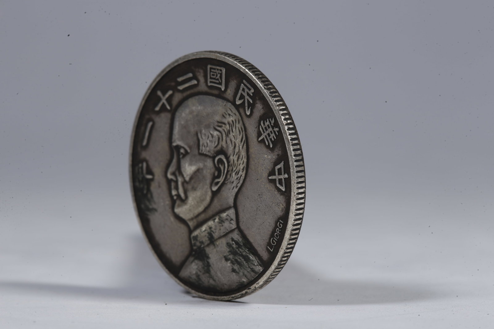 A SILVER DOLLAR COIN - 2
