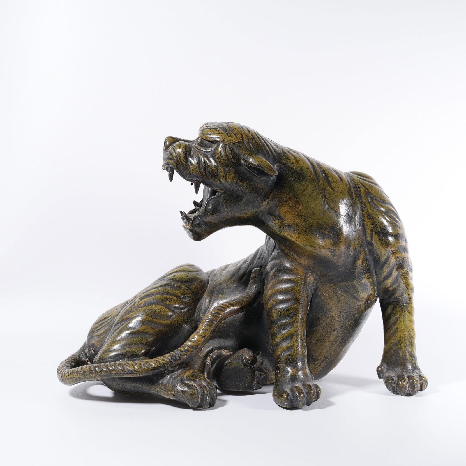 A PAINTED BRONZE TIGER-SHAPED ORNAMENT (1 of 10)