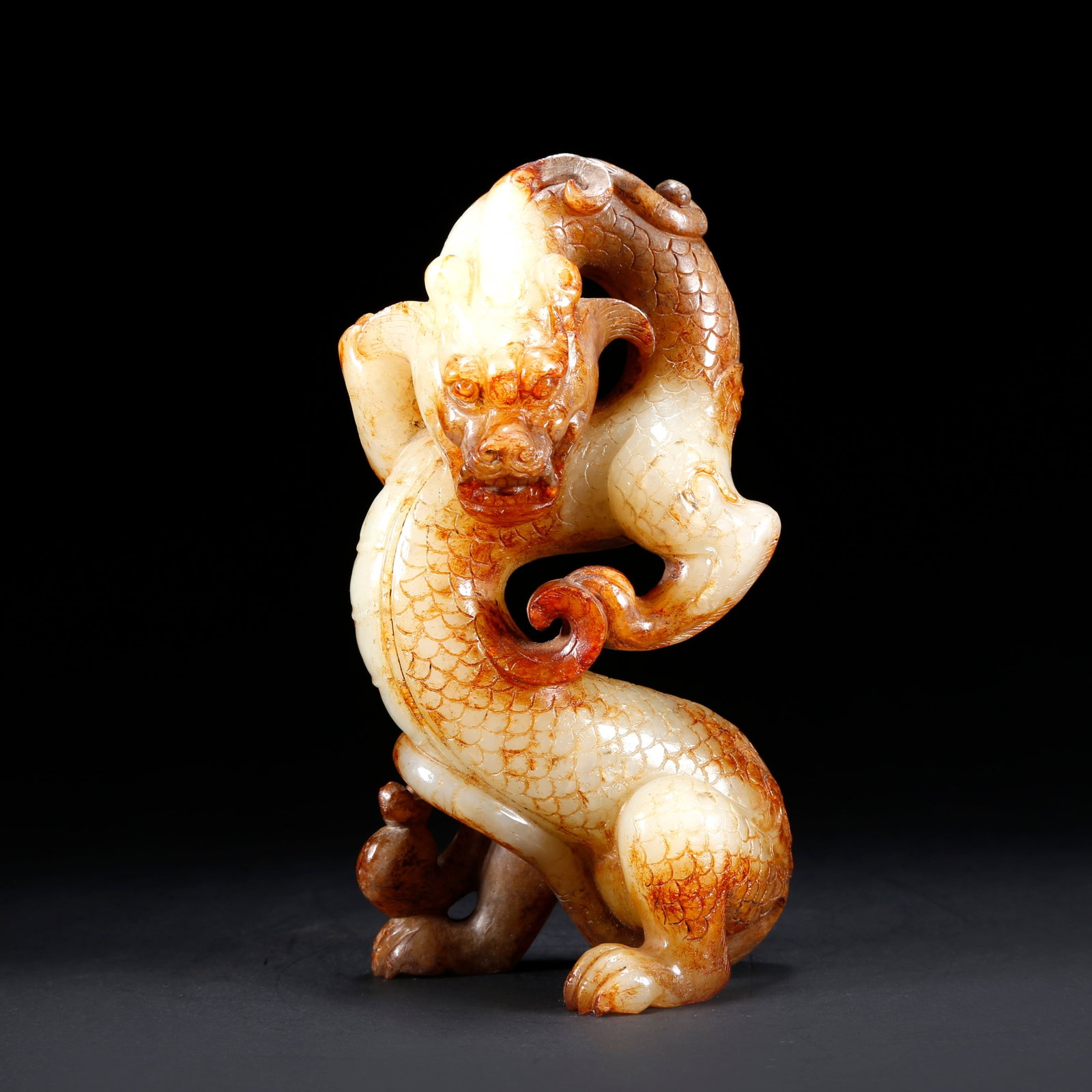 A HETIAN JADE DRAGON-SHAPED ORNAMENT (1 of 9)