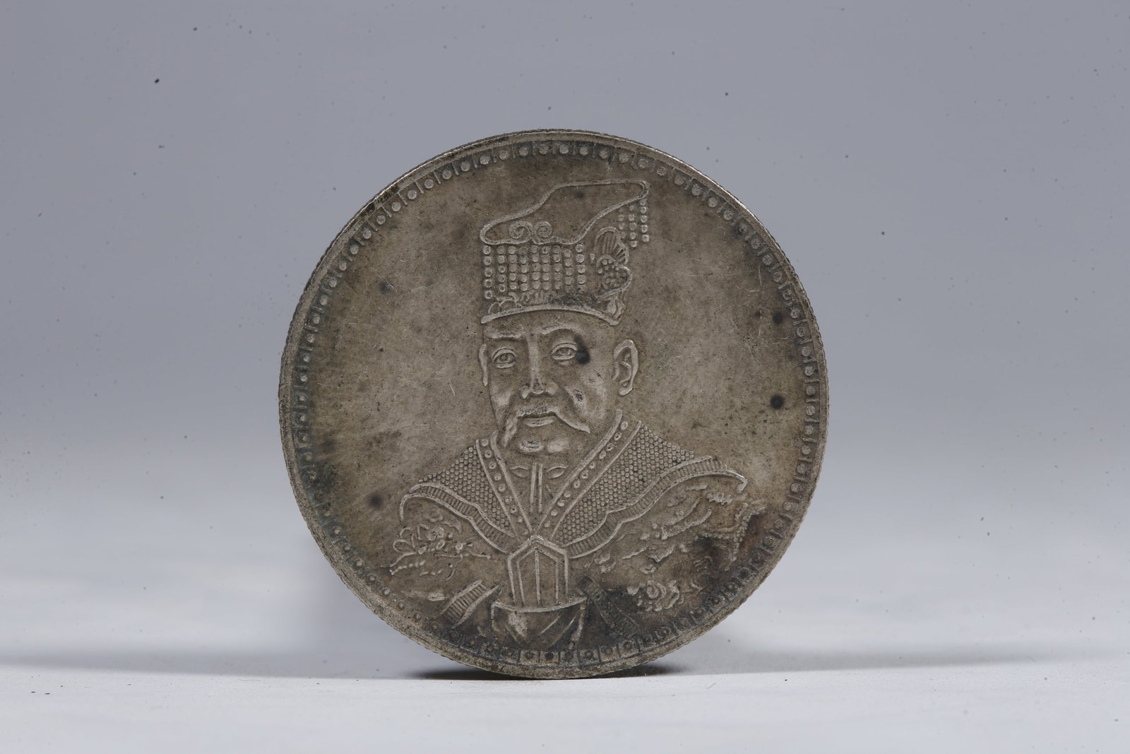 A SILVER DOLLAR COIN - 3