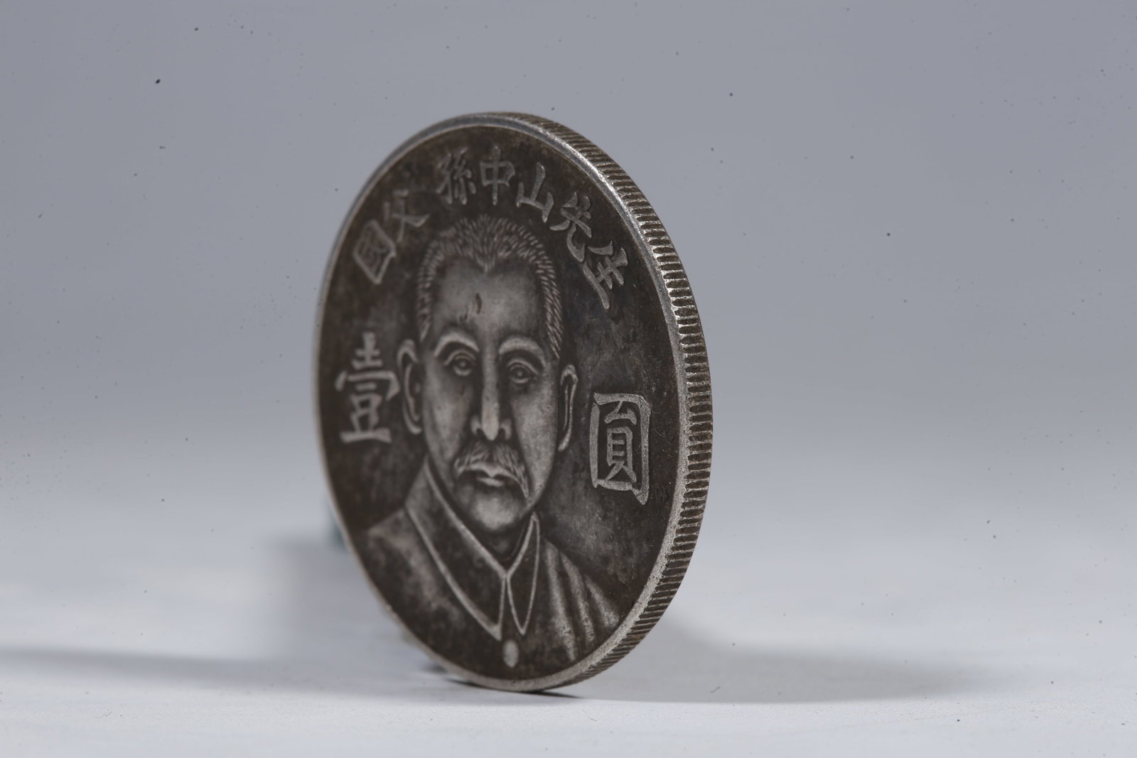 A SILVER DOLLAR COIN - 2