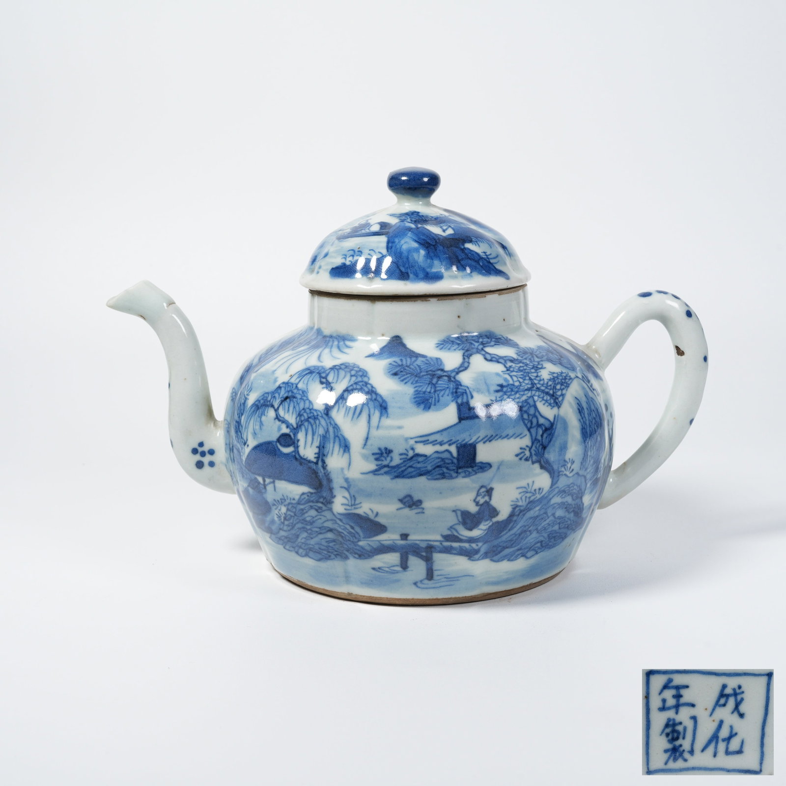 A BLUE AND WHITE EWER WITH LANDSCAPE AND FIGURE MOTIF: Blue and white ewer with landscape and figure motif