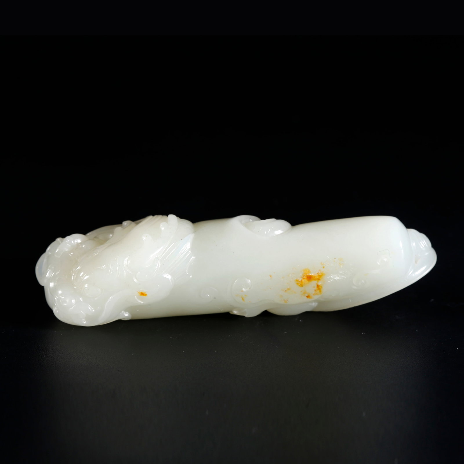 A HETIAN JADE PENDANT CARVED WITH COILED DRAGON PATTERNS (1 of 9)