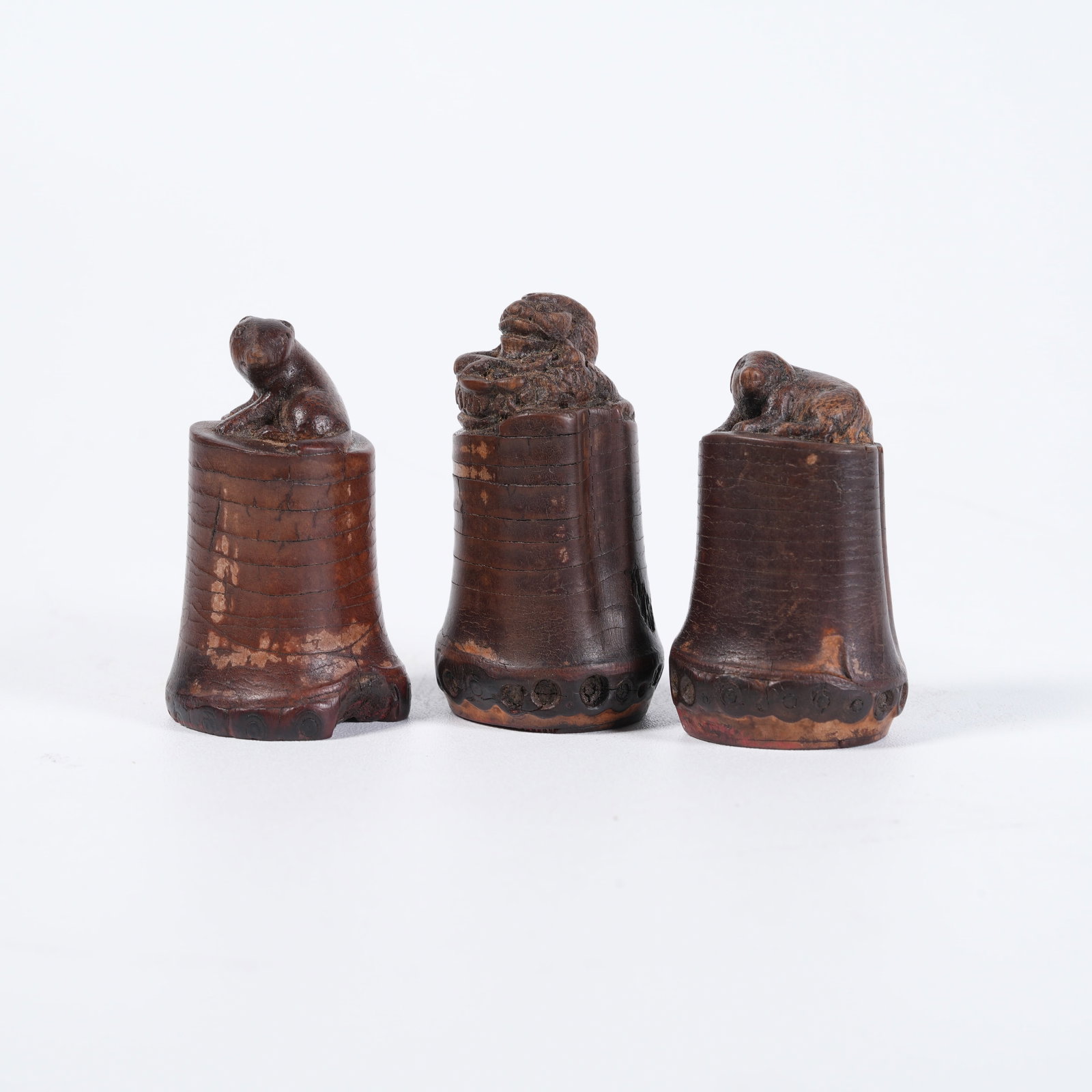 A SET OF BAMBOO-ROOT CARVED BEAST-KNOB SEALS (1 of 8)