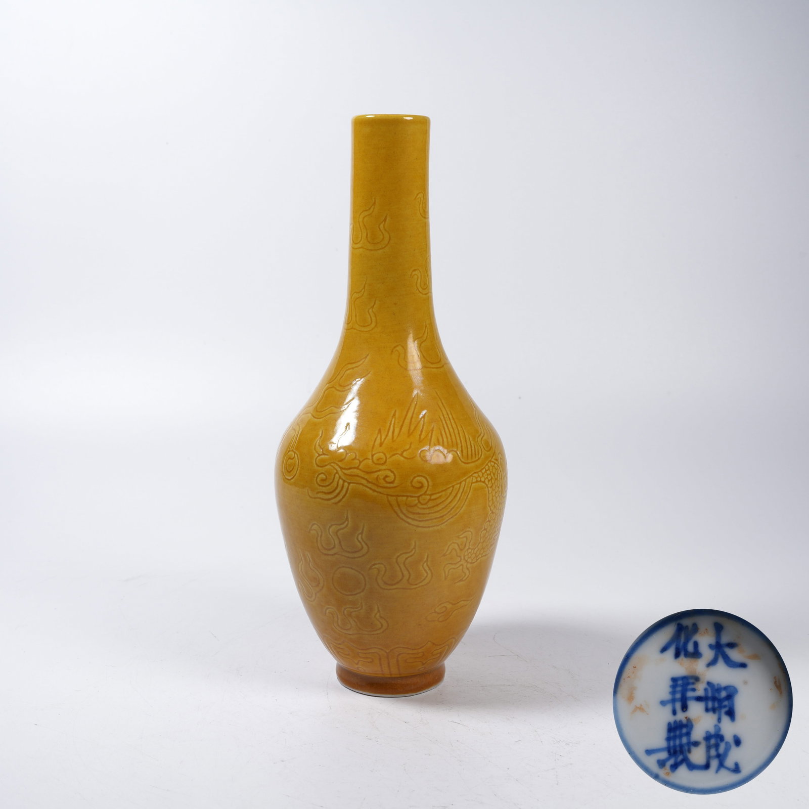 A LEMON YELLOW GLAZE LONG-NECK VASE WITH INCISED CLOUD AND DRAGON PATTERN: Lemon Yellow Glaze Long-neck Vase with Incised Cloud and Dragon Pattern