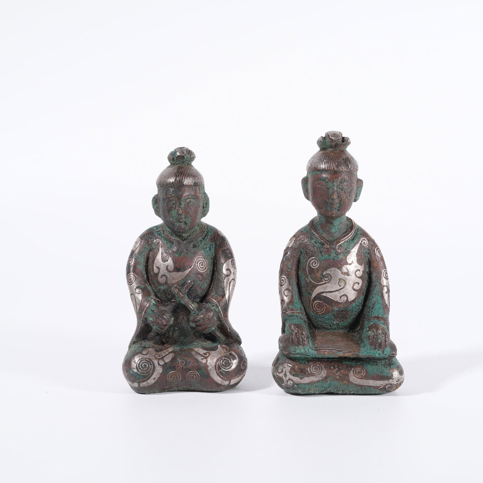 A BRONZE SILVER-INLAID FIGURE-SHAPED ORNAMENT (A PAIR): Bronze silver-inlaid figure-shaped ornament (a pair)