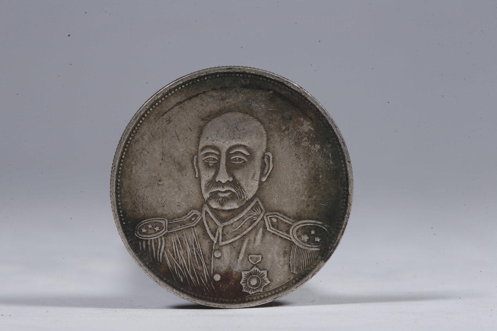 A SILVER DOLLAR COIN - 3