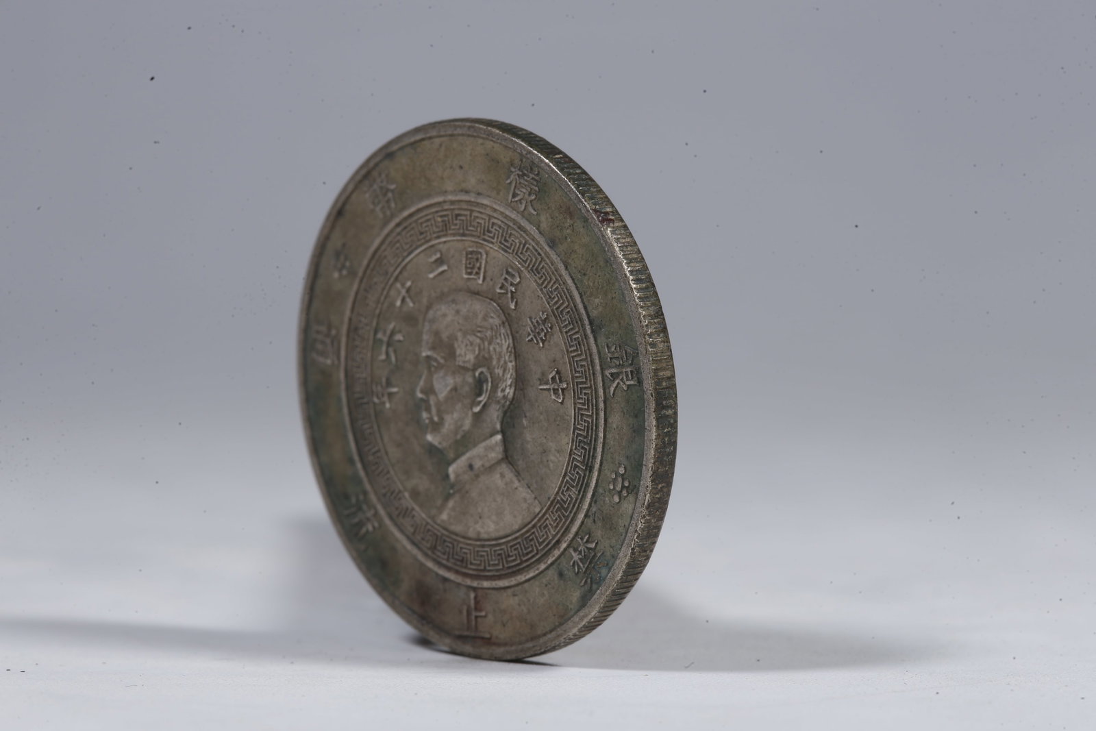 A SILVER DOLLAR COIN - 2