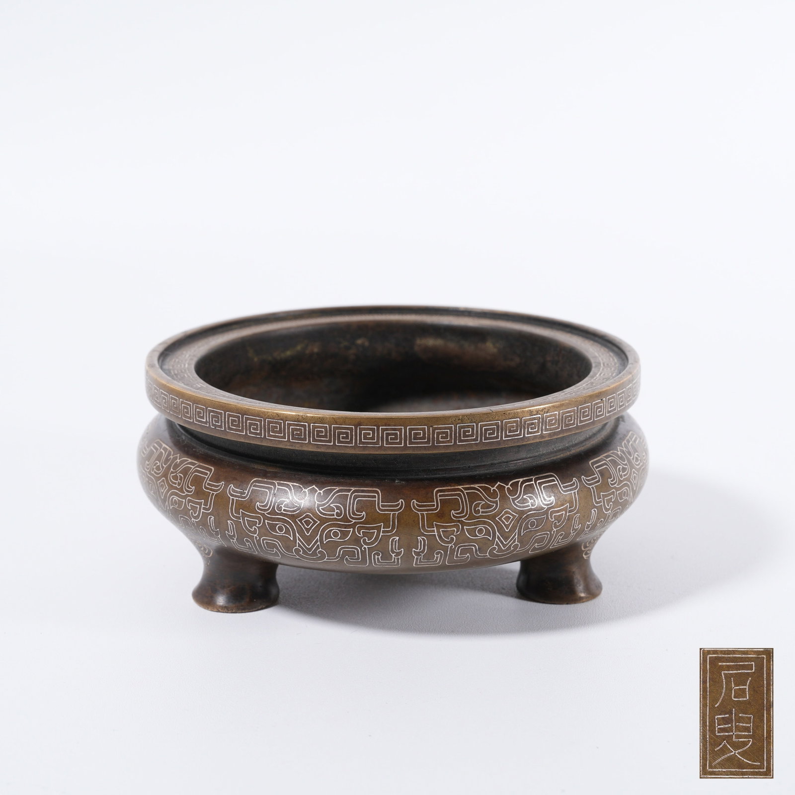 A BRONZE SILVER-INLAID BEAST-MASK-PATTERN CENSER: Bronze silver-inlaid beast-mask-pattern censer