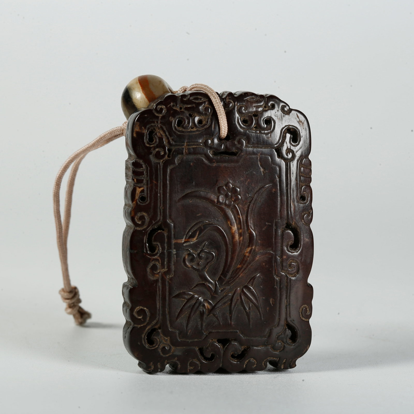 A COCONUT-SHELL PLAQUE WITH IMMORTAL-CELEBRATING-LONGEVITY PATTERN (1 of 8)