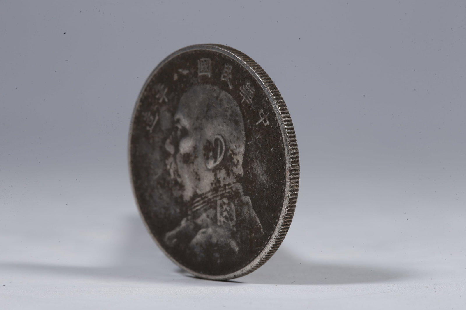 A SILVER DOLLAR COIN - 2