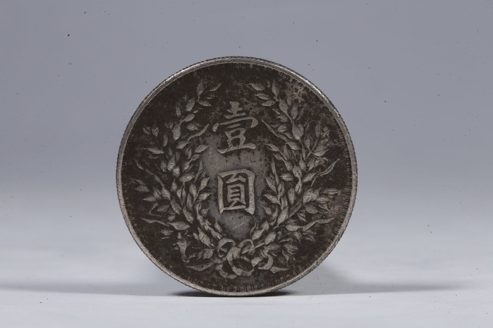 A SILVER DOLLAR COIN - 3
