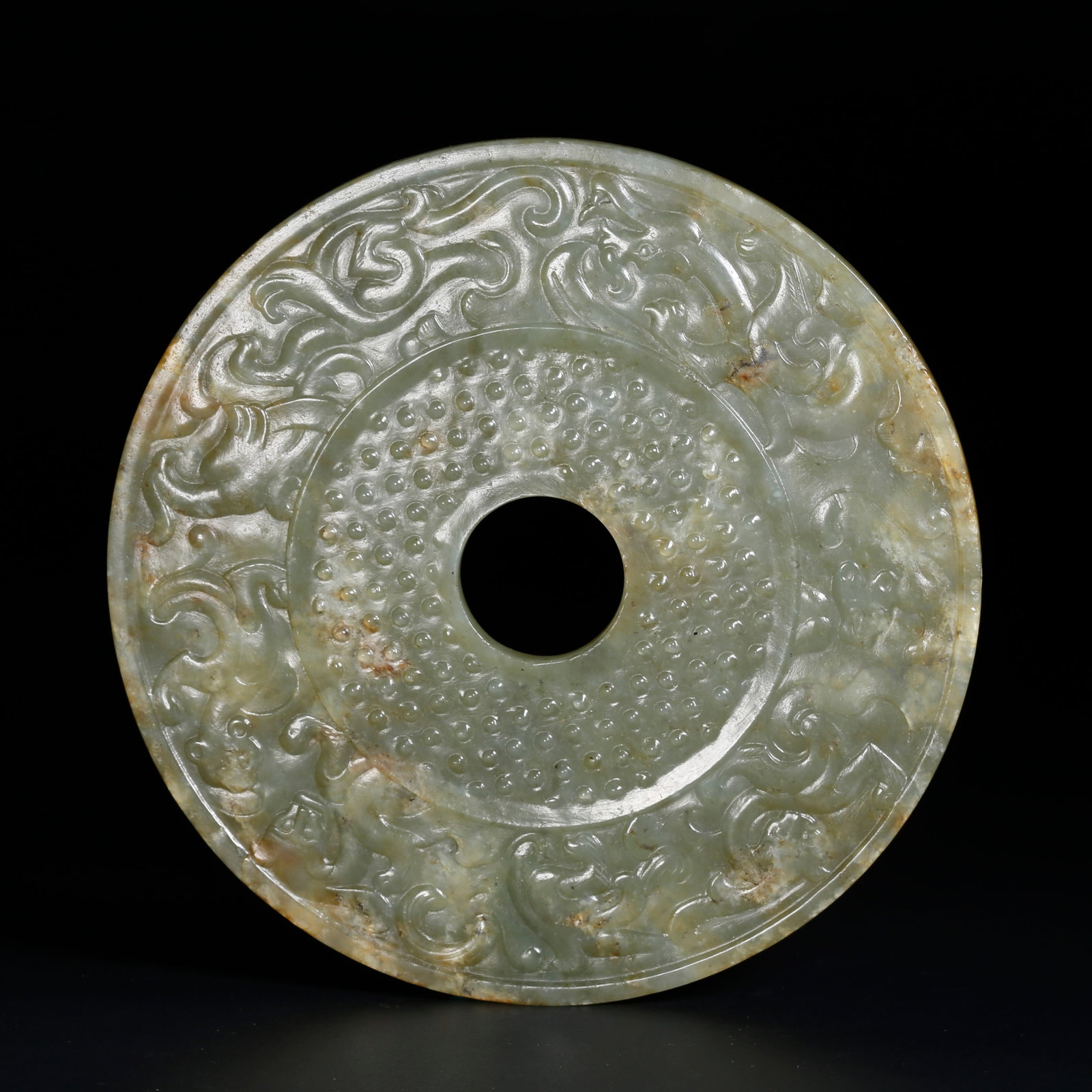 A ARCHAIC JADE BI DISC CARVED WITH DRAGON PATTERN: Archaic Jade Bi Disc Carved with Dragon Pattern
