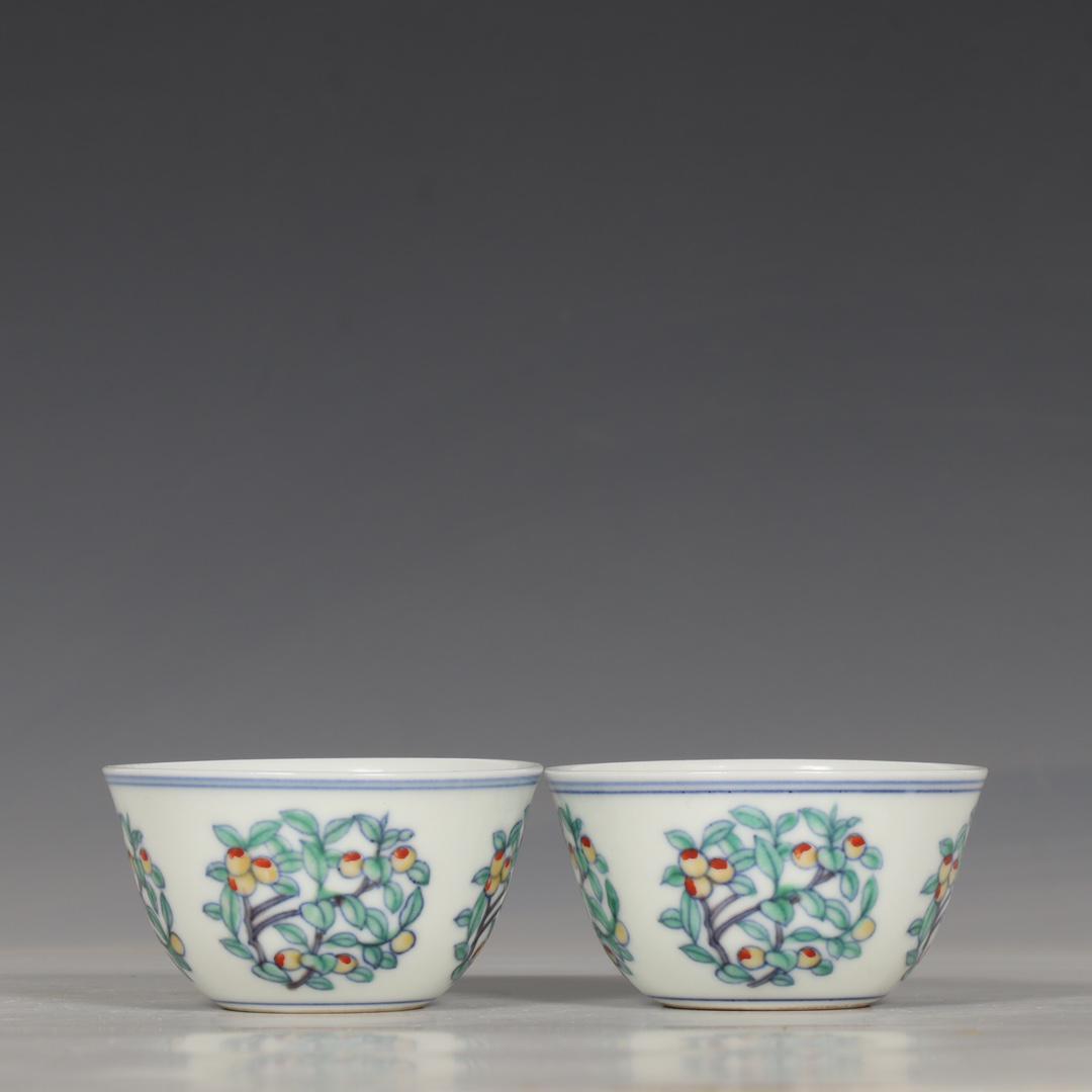 A PAIR OF DOUCAI PEACH TREE CUPS (1 of 9)