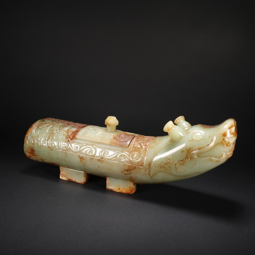 A VASE WITH DOUBLE HORNS MADE OF HETIAN JADE: Length 23.2 cm, Width 7.2 cm, Height 9 cm, Weight 1076 g