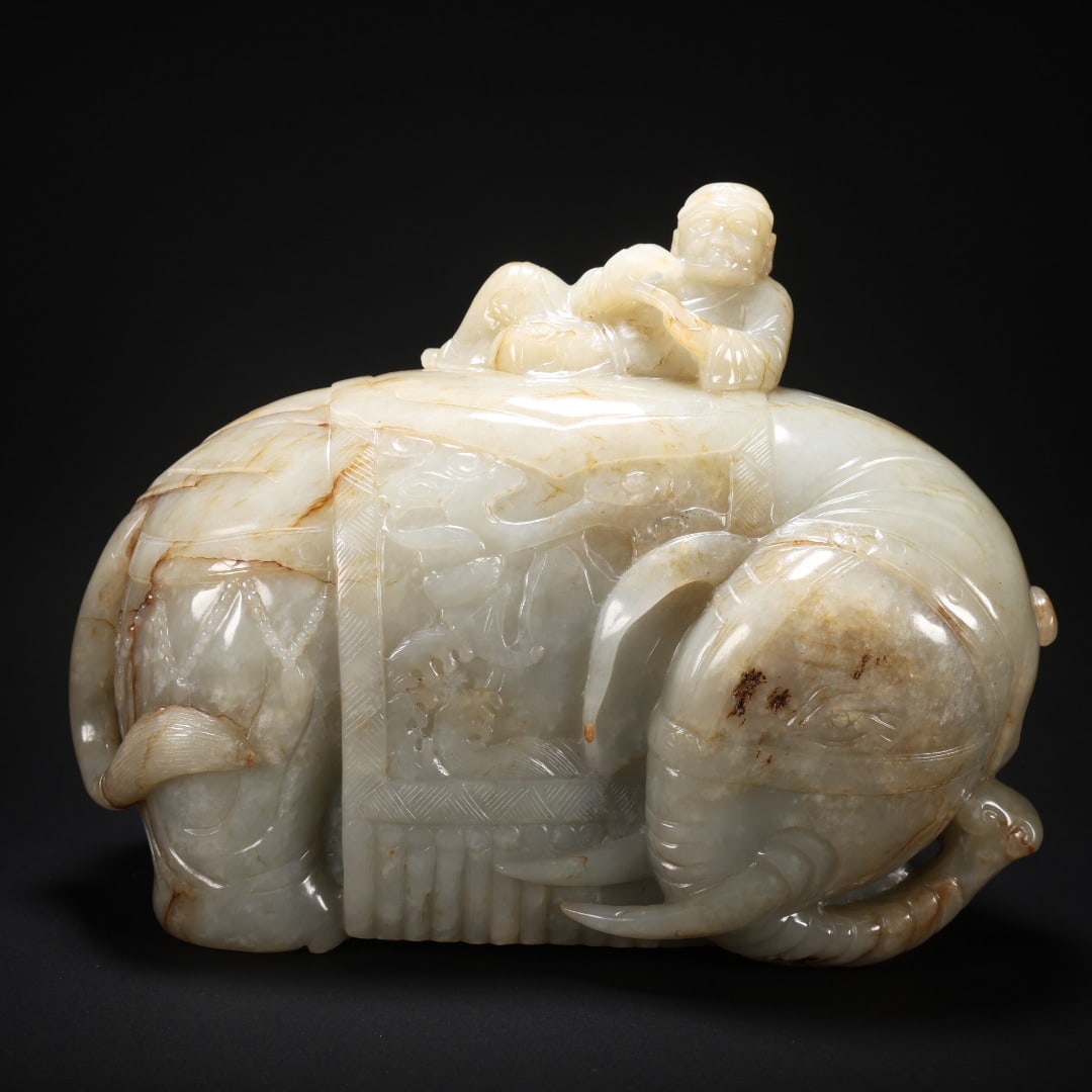 HETIAN JADE CHILD PLAYING WITH AN ELEPHANT: Length 21 cm, width 9.5 cm, height 17 cm, weight 4999 g