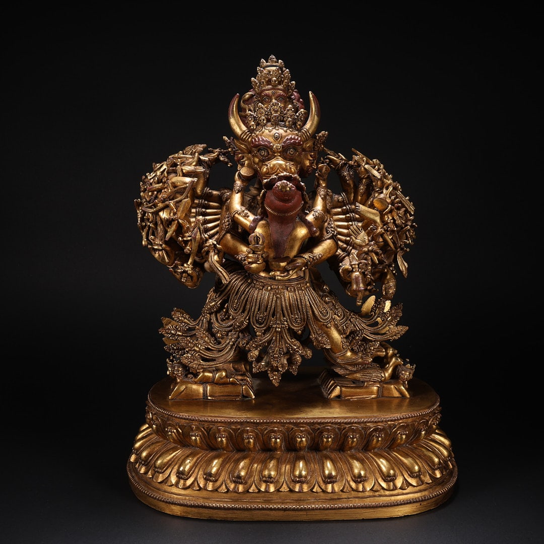 GILT BRONZE VAJRABHAIRAVA STATUE WITH MULTIPLE ARMS AND A LOTUS THRONE: Length 25.5 cm, width 17.3 cm, height 32.6 cm, weight 9696 g