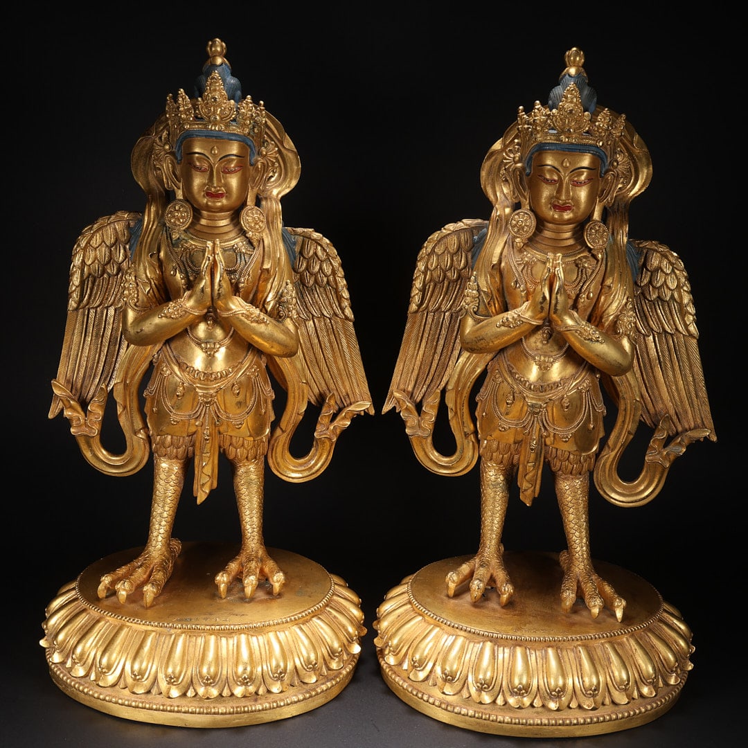 A PAIR OF GILT BRONZE GARUDA STATUES: One of them: Length 19 cm, width 15.5 cm, height 35 cm