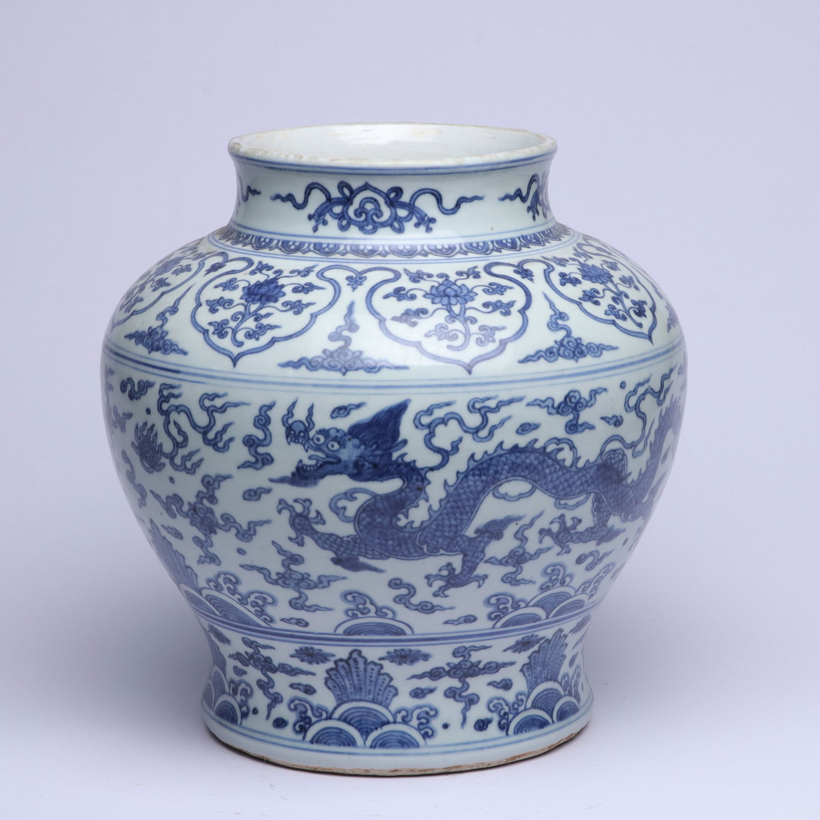 MING DYNASTY BLUE AND WHITE PORCELAIN JAR WITH CLOUD AND DRAGON DESIGN: Height 24.5cm, Width 13cm