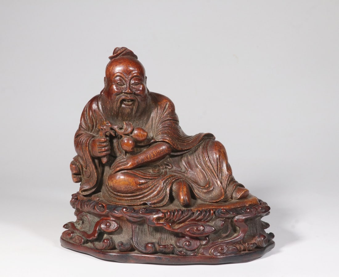 A QING DYNASTY BAMBOO CARVING OF DONGFANG SHUO (A LEGENDARY FIGURE): Height 15cm, Length 16cm, Width 11.3cm, Weight 608.5g