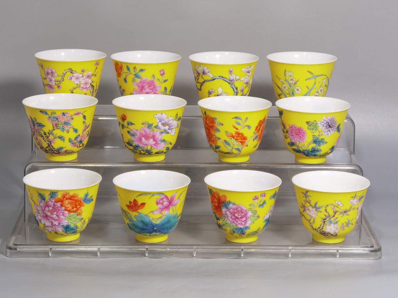 QING DYNASTY ENAMEL YELLOW GROUND TWELVE FLOWER GODDESS CUPS SET: Dimensions: Mouth diameter 6.5 cm, Height 5 cm