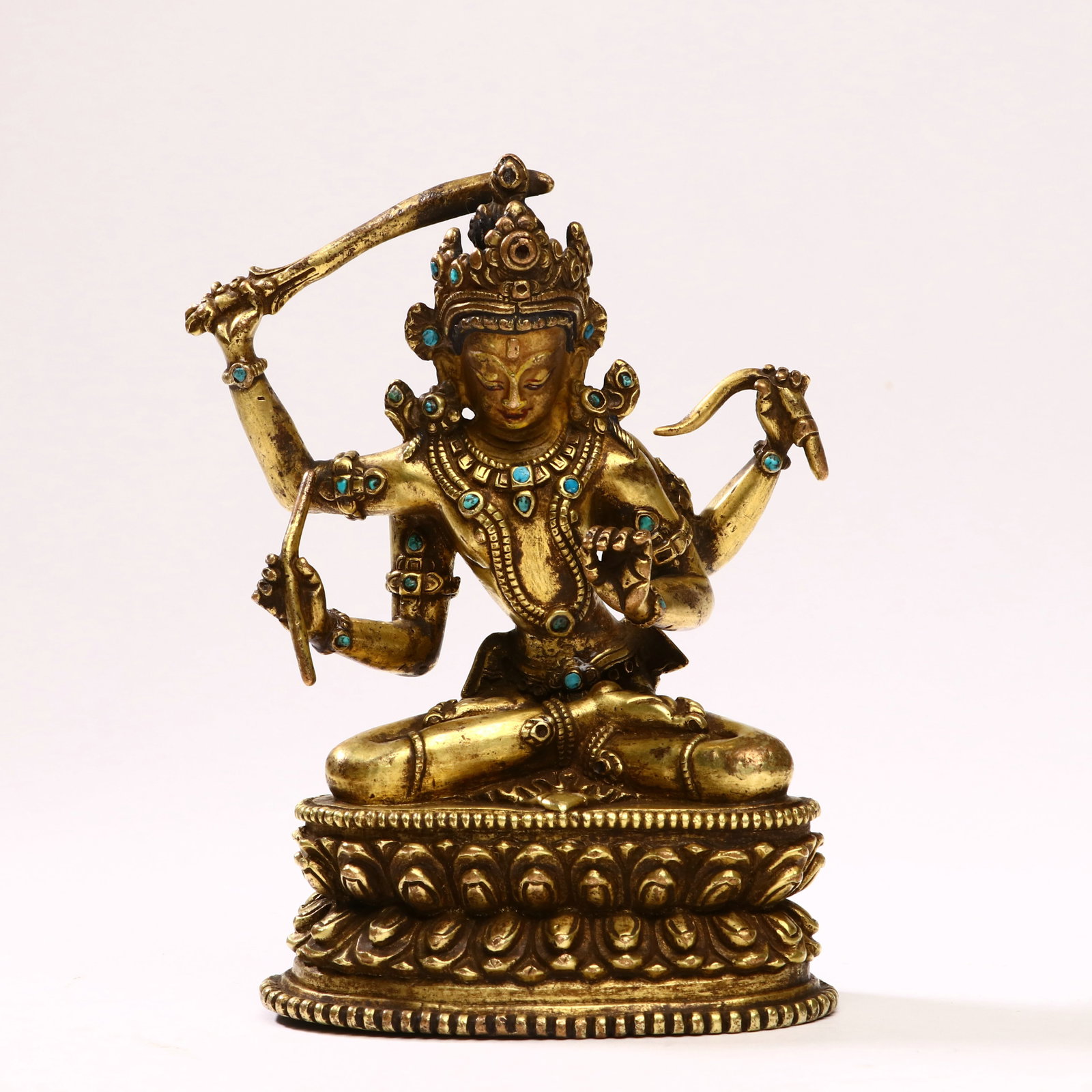 MING DYNASTY, GILT BRONZE MANJUSHRI STATUE: Height 12cm, Width 8.5cm