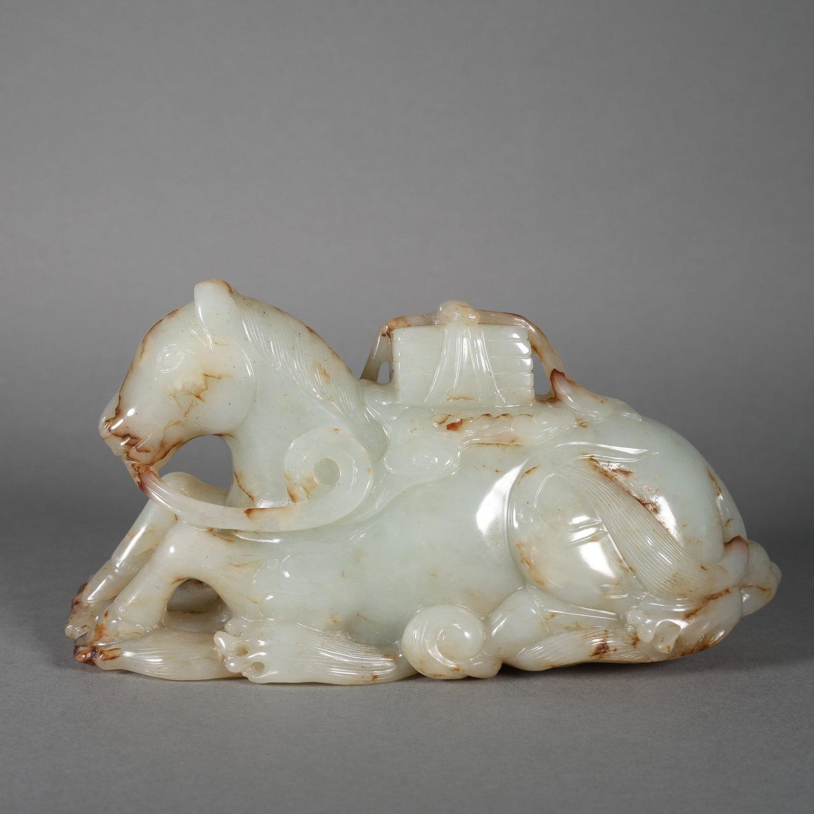 HETIAN JADE HORSE TREADING ON AUSPICIOUS CLOUDS: 15 cm long, 5 cm wide, and 8 cm high