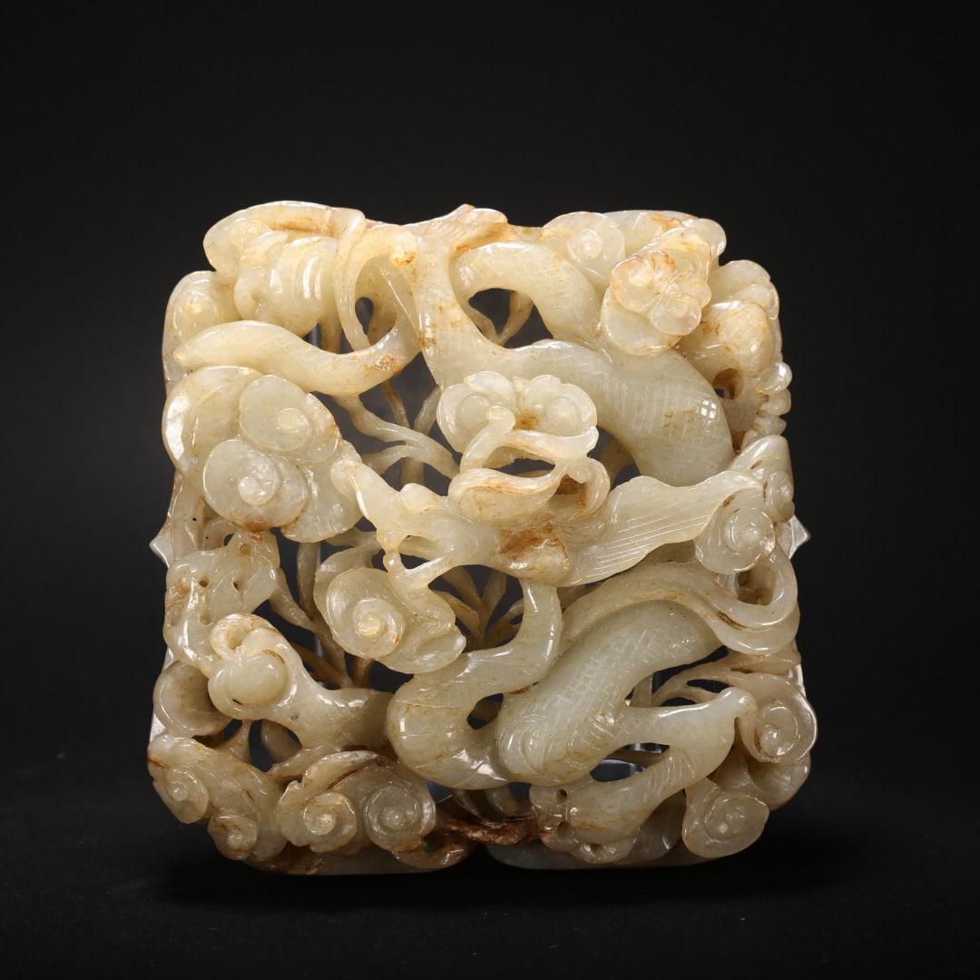 HETIAN JADE OPENWORK DRAGON AND CLOUD PENDANT: 9 cm long. 8.6 cm wide. 2 cm thick. 157 g.
