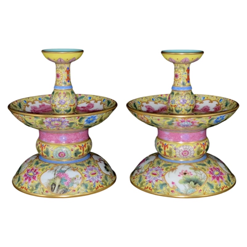 A PAIR OF YELLOW-GROUND CANDLESTICKS WITH OPEN WINDOWS MADE DURING THE QIANLONG PERIOD: Mouth diameter 5.1 cm, diameter at the mouth 13.8 cm, height 16.8 cm, base diameter 13.3 cm.