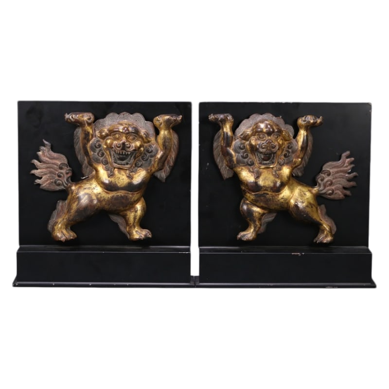 A PAIR OF TIBETAN GILT BRONZE SNOW LIONS: Dimensions: 17.3X21X4.5 cm