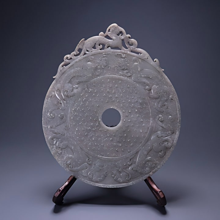 WARRING STATES AND HAN DYNASTY HETIAN JADE BI DISC WITH CHI DRAGON PATTERN (1 of 9)