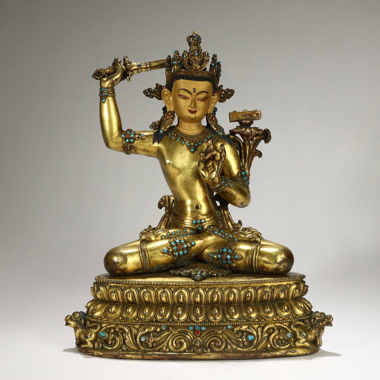 16TH-CENTURY GILT BRONZE SEATED MANJUSHRI BODHISATTVA STATUE INLAID WITH GEMSTONES: 17th-century gilt bronze seated Manjushri Bodhisattva statue inlaid with gemstones