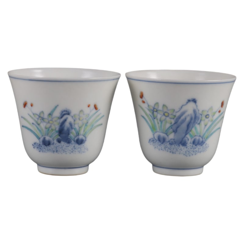 A PAIR OF DOUCAI ORCHID-PATTERNED BELL CUPS MADE DURING THE TONGZHI PERIOD OF THE QING DYNASTY: Height 5.3 cm, Diameter 6 cm