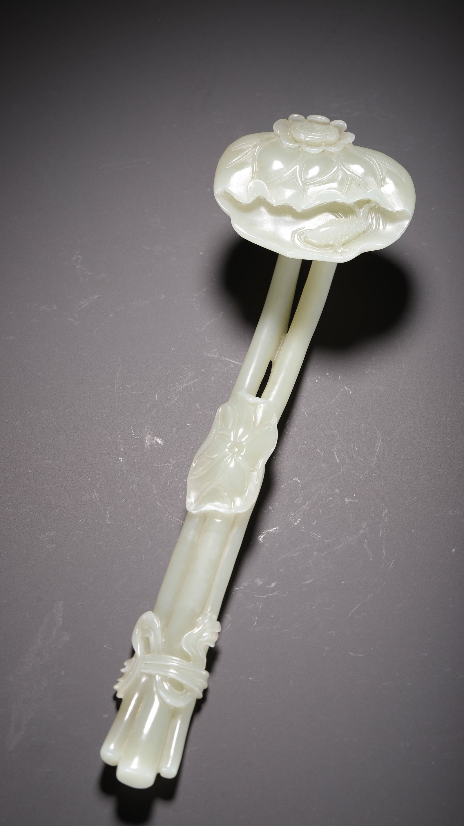 HETIAN WHITE JADE LOTUS PATTERN RUYI: 26cm long