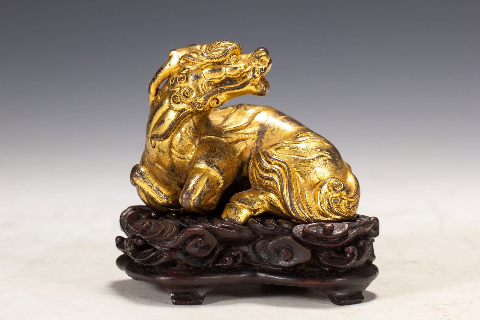 GILDED BRONZE AUSPICIOUS BEAST ORNAMENT: Length 9, Width 6, Height 9
