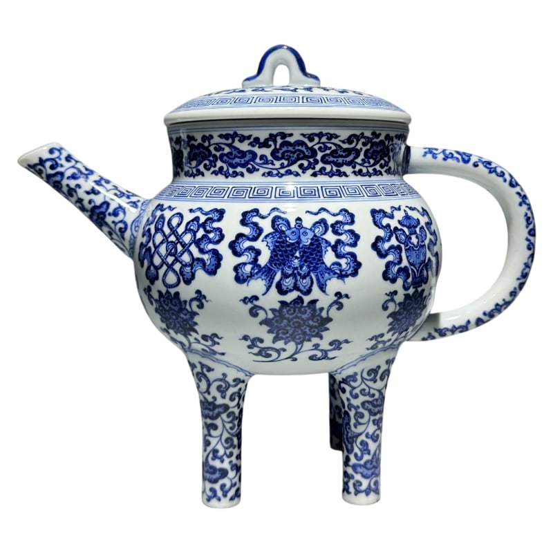 A BLUE AND WHITE PORCELAIN BOWL WITH A LOTUS SCROLL DESIGN AND EIGHT AUSPICIOUS SYMBOLS, BEARING THE: Height: 23.8 cm Width: 28 cm